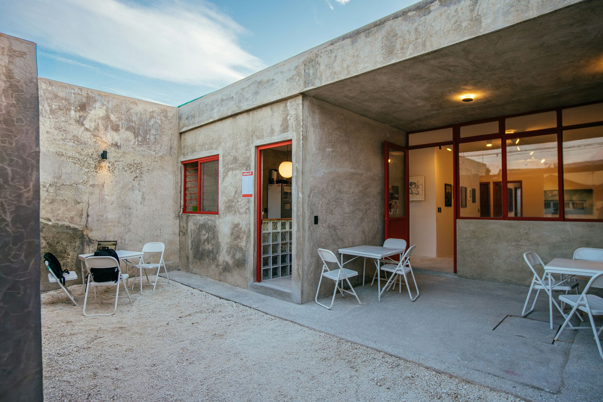 Outdoor patio area with tables and chairs